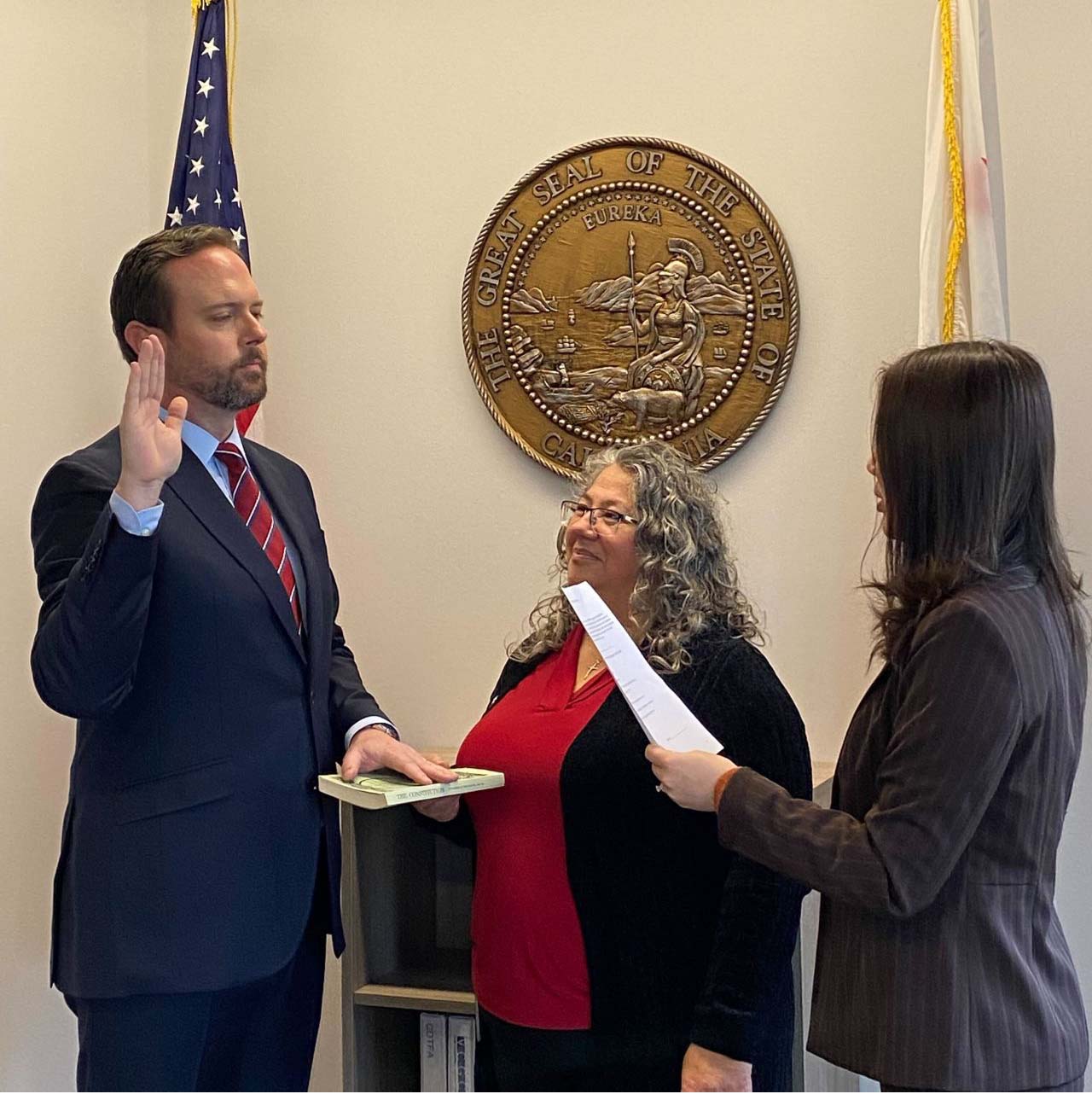 Jeffery Marino is sworn into office as director of the state's Office of Data and Innovation in January by Amy Tong (far right), secretary of the California Government Operations Agency (GovOps), as Miriam Barcellona Ingenito, undersecretary of GovOps, looks on.